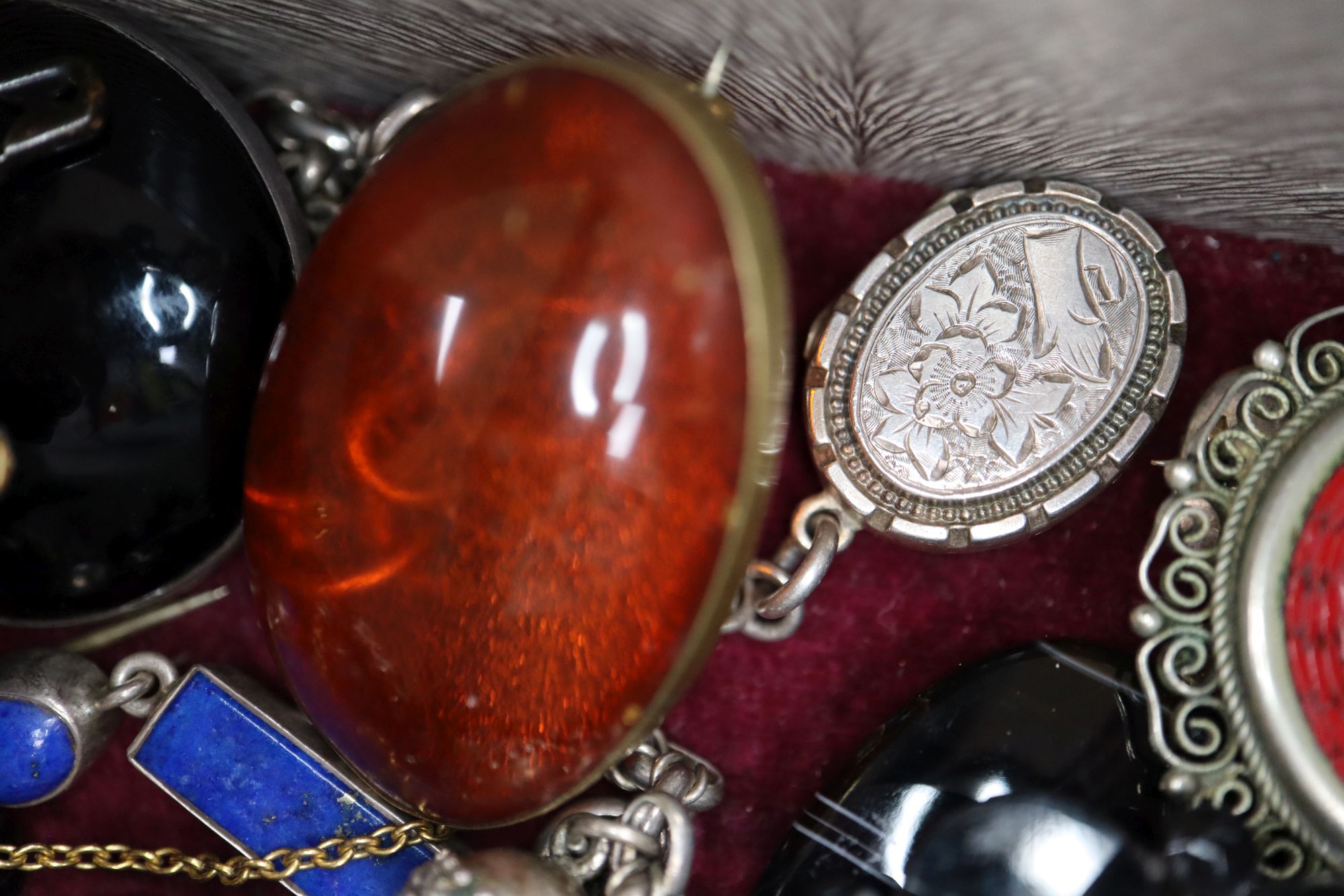 A small quantity of mixed jewellery, including a white metal locket on chain, a white metal and lapis lazuli bracelet, etc.